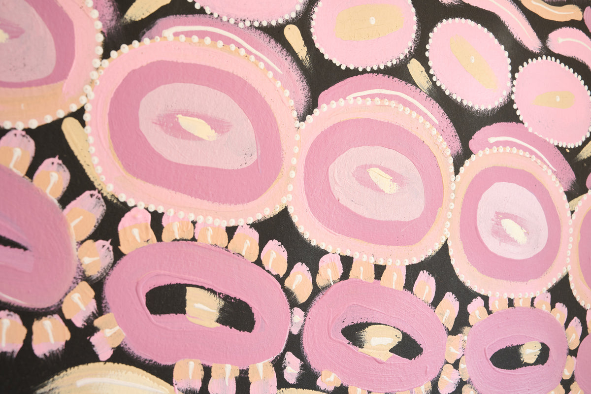 Abstract painting with pink and peach concentric oval shapes and dotted details on a black background.