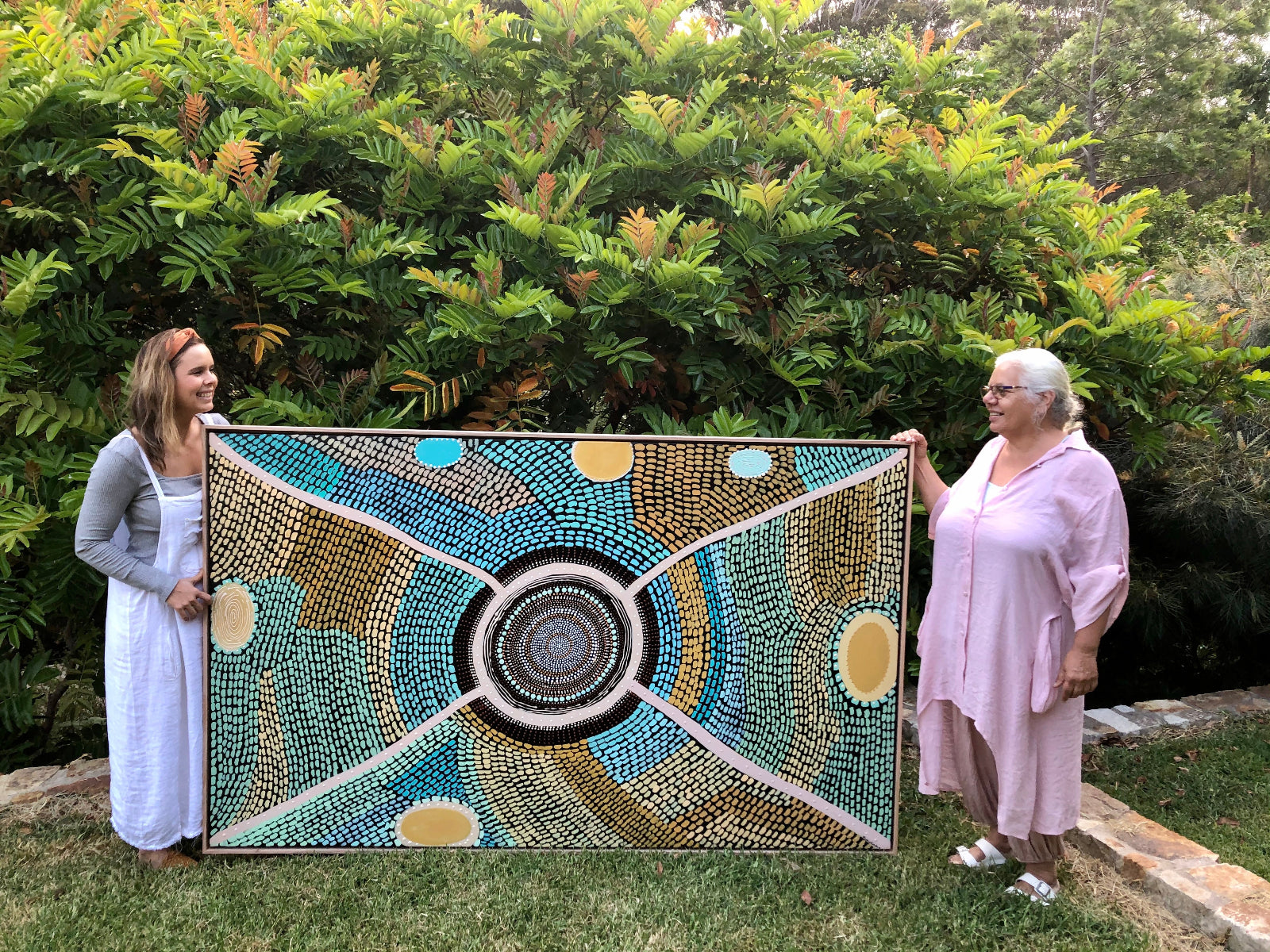 Gaagal Print Edition, Miimi and Jiinda holding the Aboriginal Artwork