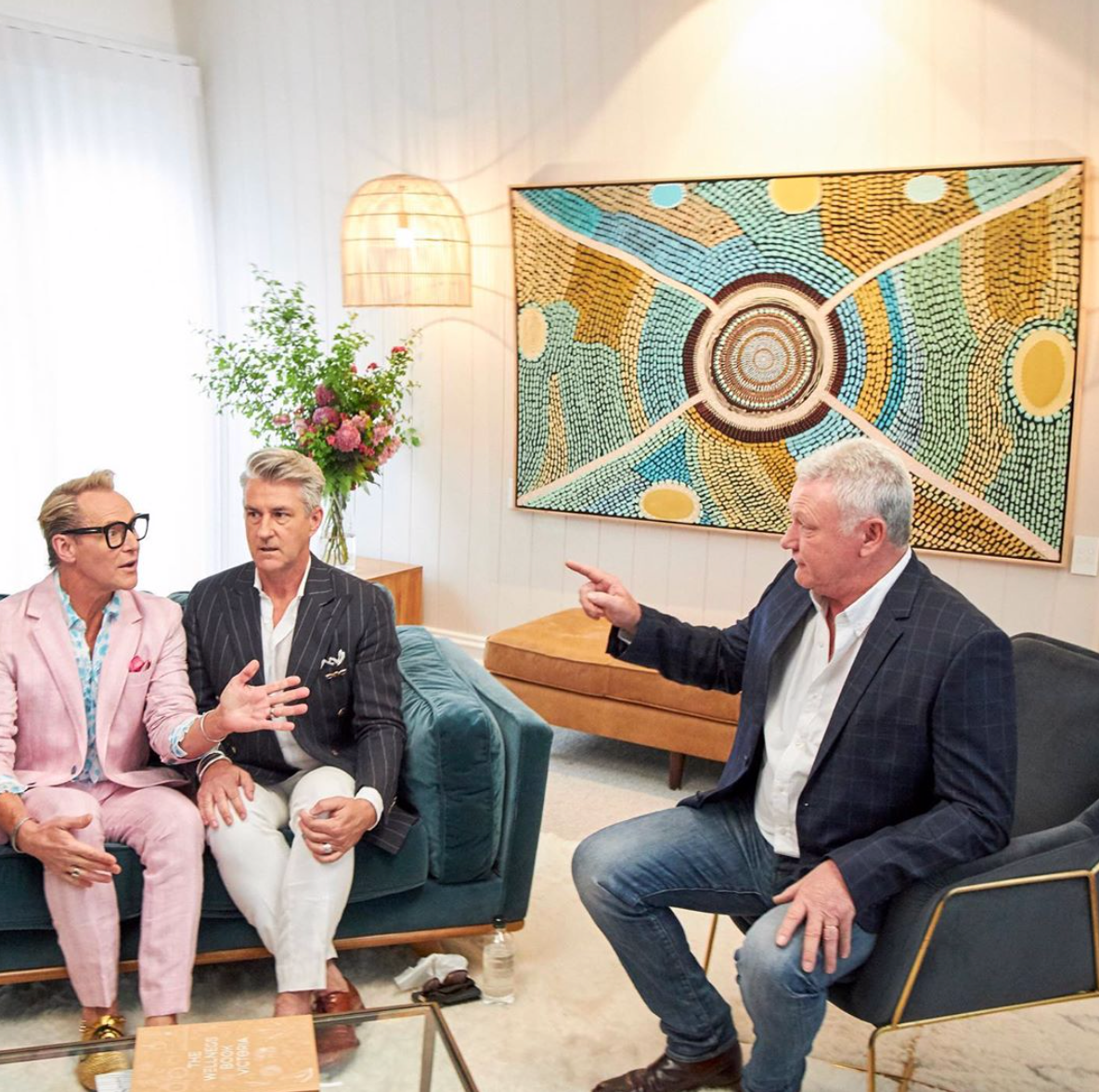 Gaagal Print Edition, behind on wall during meeting