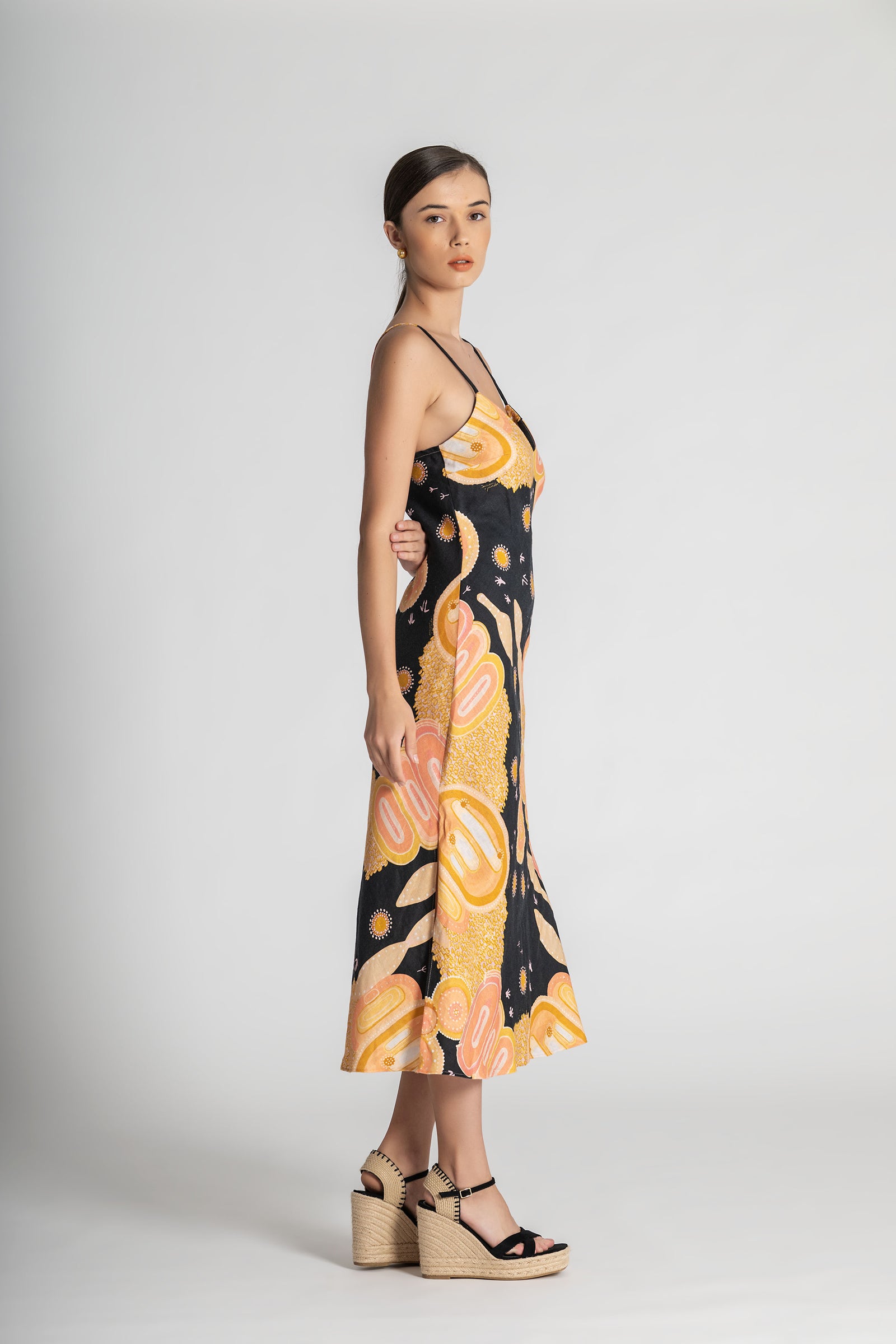 Woman wearing a floral dress with a black background